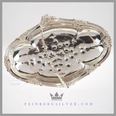 Feinberg Silver - The English silver plated oval, reticulated basket has an applied scroll and leaf border.