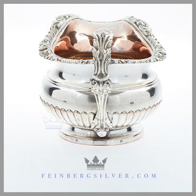 Feinberg Silver | The round, 1/2 fluted creamer has an applied gadroon and shell border and an acanthus loop handle.