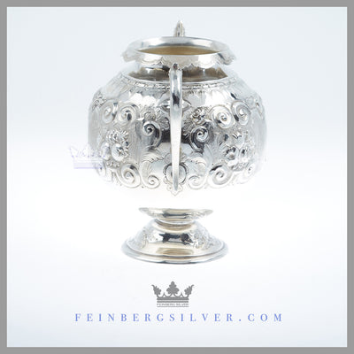 The round, large antique English silver plate sugar bowl stands on a pedestal foot, has 2 scroll acanthus handles. Feinberg Silver