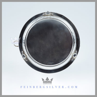 The unusual, round antique English silver plated biscuit box has an indentation on the lid to hold a flat bottom decanter. Feinberg Silver