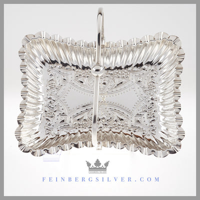 Antique Silver Wedding Centerpiece Brides Basket Feinberg Silver - The oblong English silver plated basket has a crimped edge and a simple swing handle with a ball center.