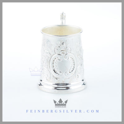 Feinberg Silver - The Antique English Silver Child's Mug's tapered vertical body has a stepped rim foot and has a cast double scroll handle.