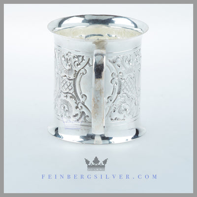 Feinberg Silver - The Antique English Silver Child's Mug's body has a splay top and bottom rim.