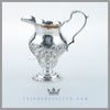 The Antique English Silver Geo III Style Cream Pitcher is baluster form and hand chased. Feinberg Silver